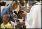 A young girl receives a blessing during a memorial Mass attended by President George W. Bush and Laura Bush at St. Louis Cathedral in New Orleans, Tuesday morning, Aug. 29, 2006, to commemorate the one- year anniversary of Hurricane Katrina. White House photo by Eric Draper