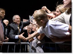 President George W. Bush greets the crowd during an airport welcome at the Utah Air National Guard in Salt Lake City, Utah, Wednesday, Aug. 30, 2006. Nearly 2000 local residents and base personnel turned out to welcome the President. "For those of you with loved ones in the United States military, I thank you from the bottom of my heart, said President Bush in his remarks. "I can't tell you how proud I am to be the Commander-in-Chief of such a fantastic group of young men and women." White House photo by Eric Draper