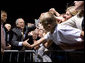 President George W. Bush greets the crowd during an airport welcome at the Utah Air National Guard in Salt Lake City, Utah, Wednesday, Aug. 30, 2006. Nearly 2000 local residents and base personnel turned out to welcome the President. "For those of you with loved ones in the United States military, I thank you from the bottom of my heart, said President Bush in his remarks. "I can't tell you how proud I am to be the Commander-in-Chief of such a fantastic group of young men and women." White House photo by Eric Draper