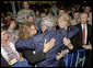 President George W. Bush greets audience members during his visit to the 88th Annual American Legion National Convention in Salt Lake City Thursday, Aug. 31, 2006. White House photo by Eric Draper