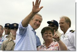 President George W. Bush waves as student Dorothy James points out other students at the Paul Hall Center for Maritime Training and Education in Piney Point, Md. Monday, September 4, 2006.  White House photo by Kimberlee Hewitt