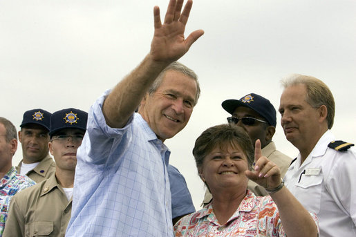 President George W. Bush waves as student Dorothy James points out other students at the Paul Hall Center for Maritime Training and Education in Piney Point, Md. Monday, September 4, 2006. White House photo by Kimberlee Hewitt