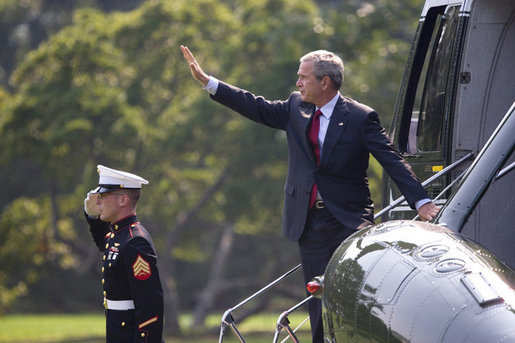 President George W. Bush waves as he prepares to depart the White House aboard Marine One from the South Lawn en route to Andrews AFB for his trip to Michigan, Friday, Sept. 8, 2006. White House photo by Eric Draper
