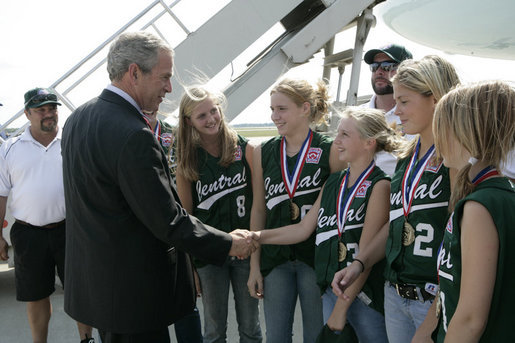 President George W. Bush is greeted Friday, Sept. 8, 2006, by members of the Mattawan Little League team from Mattawan, Mich., at Bishop International Airport in Flint, Mich. The team won all 23 games it played this summer and went on to take the 2006 Little League Softball World Series Championship. White House photo by Kimberlee Hewitt