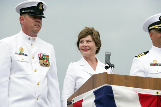 Mrs. Laura Bush smiles at Master Chief (SS) Mark K. Brooks, Command Master Chief, USS Texas, Saturday, September 9, 2006, after delivering remarks and giving the traditional command: "Man your ship and bring it to life!", during the Commissioning Ceremony in Galveston, Texas. Mrs. Bush participated in the christening of ship on July 31, 2004. White House photo by Shealah Craighead
