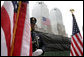 A police officer stands at attention at Ground Zero during the ceremonies marking the fifth anniversary of the September 11th terrorist attacks in New York City Sunday, September 10, 2006. White House photo by Eric Draper