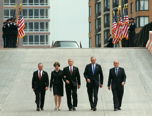 President George W. Bush and Laura Bush walk with New York City Mayor Michael Bloomberg, far left, New York Governor George Pataki, second from right, and former New York City Mayor Rudolph Giuliani down the entrance ramp to Ground Zero at the World Trade Center site in New York City Sunday, Sept. 10, 2006. White House photo by Kimberlee Hewitt