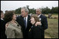 President George W. Bush embraces family members of those killed aboard United Flight 93 during the ceremony Monday, Sept. 11, 2006 in Shanksville, Pa., commemorating the fifth anniversary of the attacks on Sept. 11, 2001. White House photo by Eric Draper