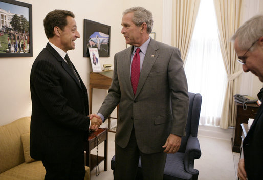 President George W. Bush drops by a meeting between National Security Advisor Stephen Hadley and France's Minister of the Interior and Regional Development Nicolas Sarkozy at the White House Tuesday, Sept. 12, 2006. White House photo by Kimberlee Hewitt