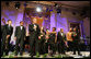 President George W. Bush stands with performers on stage in the East Room Thursday night, Sept. 14, 2006, as he offers closing remarks to guests at the Thelonious Monk Institute of Jazz dinner at the White House. White House photo by Shealah Craighead