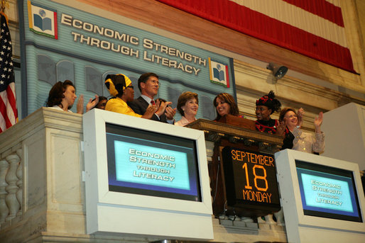 Mrs. Laura Bush is applauded as she stands over the New York Stock Exchange Monday, Sept. 18, 2006, where she visited to highlight literacy's role in extending the benefits of free enterprise to individuals around the world. White House photo by Shealah Craighead