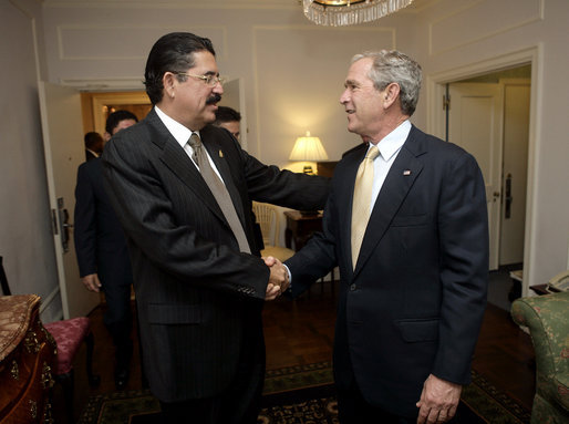 President George W. Bush and President Manuel Zelaya of Honduras greet each other before meeting, Monday, Sept. 18, 2006, at the Waldorf-Astoria Hotel in New York. White House photo by Eric Draper