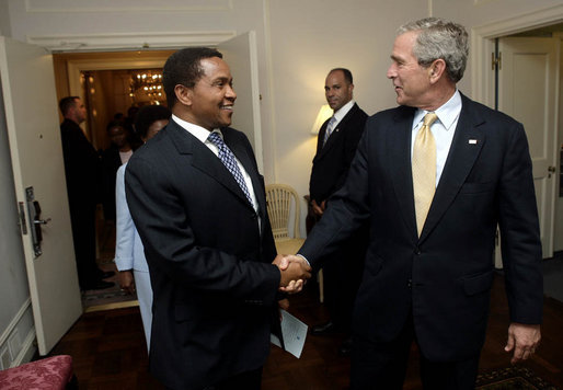President George W. Bush welcomes President Jakaya Kikwete of the United Republic of Tanzania, for their bilateral meeting Monday, Sept. 18, 2006, at the Waldorf-Astoria Hotel in New York City. White House photo by Eric Draper