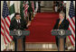 President George W. Bush listens as President Pervez Musharraf, of the Islamic Republic of Pakistan, responds to a question Friday, Sept. 22, 2006, during a joint press availability at the White House. White House photo by Eric Draper