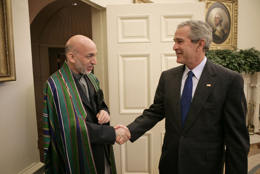 President George W. Bush welcomes President Hamid Karzai of Afghanistan to the Oval Office Tuesday, Sept. 26, 2006. White House photo by Eric Draper