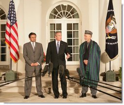 President George W. Bush stands with President Pervez Musharraf of the Islamic Republic of Pakistan, left, and President Hamid Karzai of the Islamic Republic of Afghanistan, Wednesday evening, Sept. 27, 2006, in the Rose Garden at the White House speaking to reporters prior to the three leaders attending a private dinner. White House photo by David Bohrer