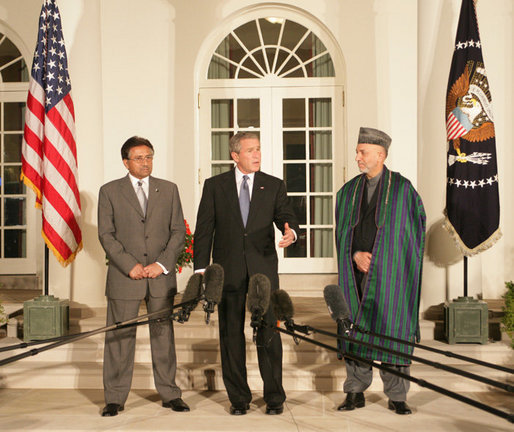 President George W. Bush stands with President Pervez Musharraf of the Islamic Republic of Pakistan, left, and President Hamid Karzai of the Islamic Republic of Afghanistan, Wednesday evening, Sept. 27, 2006, in the Rose Garden at the White House speaking to reporters prior to the three leaders attending a private dinner. White House photo by David Bohrer