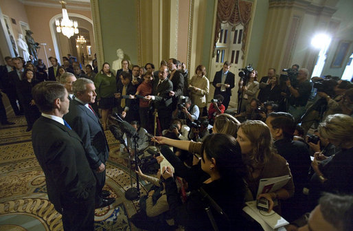 President George W. Bush stands with Senators Bill Frist, pictured in the foreground, and Mitch McConnell as he addresses the press after meeting with the Republican Senate Conference at the U. S. Capitol Thursday, Sept. 28, 2006. White House photo by Eric Draper