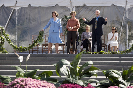 Mrs. Laura Bush joined by, left, Leone Reeder, Chair, National Fund for the U.S. Botanic Garden, and, right, Jim Hagedorn, Co-Chair, Board of Trustees, National Fund for the U.S. Botanic Garden, while the Ceremonial Garland is cut Friday, September 29, 2006, during a ceremony to celebrate the completion of the National Garden at the United States Botanic Garden in Washington, D.C. This new facility, located on a three-acre site just west of the Conservatory, will be a showcase for unusual, useful, and ornamental plants that grow well in the mid-Atlantic region. White House photo by Shealah Craighead