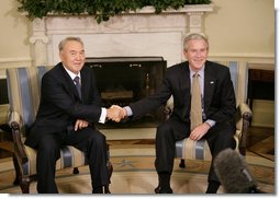 President George W. Bush and Kazakhstan President Nursultan Nazarbayev shake hands during their meeting Friday, Sept. 29, 2006 in the Oval Office at the White House. White House photo by Eric Draper