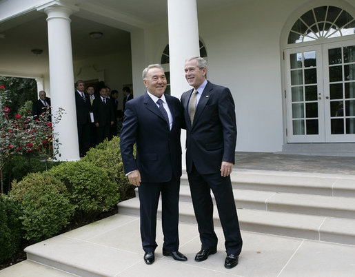 President George W. Bush walks with Kazakhstan President Nursultan Nazarbayev out to the Rose Garden at the White House, Friday, Sept. 29, 2006, following their meeting in the Oval Office. White House photo by Eric Draper