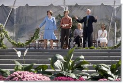 Mrs. Laura Bush joined by, left, Leone Reeder, Chair, National Fund for the U.S. Botanic Garden, and, right, Jim Hagedorn, Co-Chair, Board of Trustees, National Fund for the U.S. Botanic Garden, while the Ceremonial Garland is cut Friday, September 29, 2006, during a ceremony to celebrate the completion of the National Garden at the United States Botanic Garden in Washington, D.C. This new facility, located on a three-acre site just west of the Conservatory, will be a showcase for unusual, useful, and ornamental plants that grow well in the mid-Atlantic region.  White House photo by Shealah Craighead