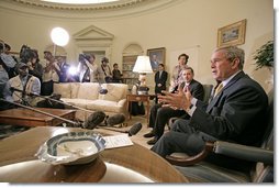 President George W. Bush and Prime Minister Recep Tayyip Erdogan of Turkey talk to the press in the Oval Office Monday, October 2, 2006. "We had an important discussion about both Iraq and Iran. Our desire is for -- to help people who care about a peaceful future to reject radicalism and extremism," said President Bush.  White House photo by Eric Draper
