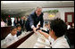  President George W. Bush greets students during a tour of the Laura Bush Library at George W. Bush Elementary School in Stockton, Calif., Tuesday, Oct. 3, 2006. White House photo by Eric Draper