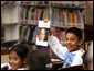 A student holds up a book about President George W. Bush during the President's visit to the elementary school named after him in Stockton, Calif., Tuesday, Oct. 3, 2006. White House photo by Eric Draper