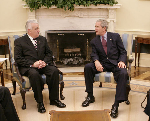 President George W. Bush meets with American Legion National Commander Paul Morin of Chicopee, Mass., in the Oval Office at the White House, Thursday, Oct. 5, 2006. White House photo by Eric Draper