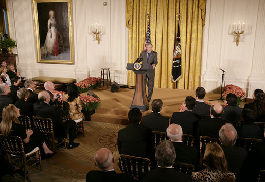 President George W. Bush welcomes invited guests Friday, Oct. 6, 2006 to the East Room of the White House, as part the festivities in celebration of National Hispanic Heritage Month. White House photo by Kimberlee Hewitt