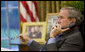 President George W. Bush speaks on the phone with Senegalese President Abdoulaye Wade in the Oval Office Friday, Oct. 6, 2006, about the current crisis in Darfur. White House photo by Eric Draper
