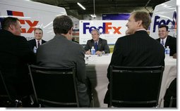 President George W. Bush meets with business leaders Friday, Oct. 6, 2006, at the FedEx Express DCA Facility in Washington, D.C., during a roundtable discussion on job growth and the economy. President Bush was joined at the meeting by U.S. Secretary of the Treasury Henry Paulson and Al Hubbard, Assistant to the President for Economic Policy.  White House photo by Kimberlee Hewitt