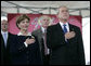 President George W. Bush and Mrs. Laura Bush stand for the National Anthem during the Christening Ceremony of the George H.W. Bush (CVN 77) in Newport News, Virginia, Saturday, Oct. 7, 2006. White House photo by Eric Draper