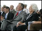 Former President George H. W. Bush and First Lady Barbara Bush react during remarks by President George W. Bush during the Christening Ceremony for the George H.W. Bush (CVN 77) in Newport News, Virginia, Saturday, Oct. 7, 2006. White House photo by Eric Draper