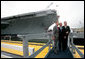 President George W. Bush, father President George H. W. Bush and brother Florida Governor Jeb Bush depart at the conclusion of the Christening Ceremony for the George H.W. Bush (CVN 77) in Newport News, Virginia, Saturday, Oct. 7, 2006. White House photo by Eric Draper