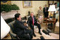 President George W. Bush laughs with President Alan Garcia of Peru during a meeting with the press in the Oval Office Tuesday, Oct. 10, 2006. “We see our role as a country in terms of helping strengthen democracy and achieving friendship without threat in our region,” said President Garcia. “And in this regard, Peru will continue to work towards the democratization of Latin America.” White House photo by Eric Draper