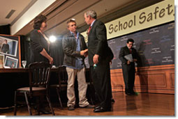President George W. Bush talks with former Columbine High School student Craig Scott during a panel discussion on school safety at the National 4-H Conference Center in Chevy Chase, Md., Tuesday, Oct. 10, 2006. "All of us in this country want our classrooms to be gentle places of learning, places where people not only learn the basics -- basic skills necessary to become productive citizens, but learn to relate to one another," said President Bush. "And our parents I know want to be able send their child or children to schools that are safe places." White House photo by Kimberlee Hewitt