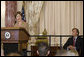 Newly sworn-in Ambassador Mark Dybul, Coordinator of the Office of the US Global AIDS, looks at Mrs. Laura Bush as she speaks to an audience of Ambassadors to the United States, government officials, representatives from the public health sector and Non-Governmental Organizations Tuesday, October 10, 2006, during the swearing-in ceremony of Ambassador Mark Dybul in the Benjamin Franklin Room at the U.S. Department of State in Washington, D.C. Ambassador Dybul will coordinate and oversee the U.S. global response to HIV/AIDS, and lead implementations of the U.S. President's Emergency Plan for AIDS Relief (Emergency Plan/PEPFAR), the largest commitment ever by any nation for an international health initiative dedicated to a single disease. White House photo by Shealah Craighead