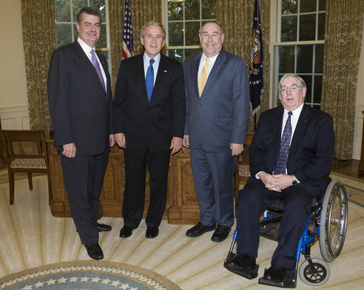 President George W. Bush welcomes Bob Wallace, left, the executive director of the Veterans of Foreign Wars Washington Office; Gary Kurpius, the National Commander-In-Chief of the Veterans of Foreign Wars and Gordon Mansfield, right, the deputy secretary at the Department of Veterans Affairs, to the Oval Office for a meeting Wednesday, Oct. 11, 2006. The VFW, founded in 1899, is the largest organization of combat veterans with some 2.4 million members in 9,500 VFW Posts worldwide. White House photo by Paul Morse