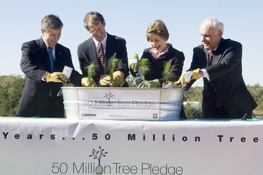 Mrs. Laura Bush is joined by, from left, U.S. Department of Agriculture Secretary Mike Johanns; John Rosenow, president of the National Arbor Day Foundation, and Andy Taylor, chairman and CEO of Enterprise Rent-A-Car, as they plant White Pine saplings Thursday, October 11, 2006, during a ceremony for the Enterprise 50 Million Tree Pledge in St. Louis, Missouri. Enterprise Rent-A-Car donated $50 million to the National Arbor Day Foundation to plant 50 million trees in National Forests over the next 50 years. The White Pine saplings planted at the ceremony will be re-planted permanently in the Mark Twain National Forest in southern Missouri. White House photo by Shealah Craighead