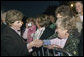 Mrs. Laura Bush greets members of the audience members that include representatives from breast cancer organizations, supporters of breast cancer research, breast cancer survivors and local residents during the Arch Lighting for Breast Cancer Awareness Thursday, Oct. 12, 2006, in St. Louis. White House photo by Shealah Craighead
