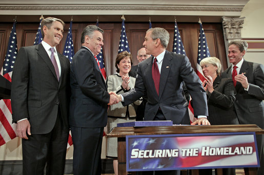 President George W. Bush shakes hands with Congressman Peter King, R-N.Y., chairman of the Homeland Security Committee, after signing H.R. 4954, the SAFE Port Act, in the Dwight D. Eisenhower Executive Office Building Friday, Oct. 13, 2006. Also pictured from left are Sen. Bill Frist, R-Tenn.; Sen. Susan Collins, R-Maine; Sen. Robert Bennett, R-Utah; Sen. Patty Murray, D-Wash.; and Sen. Norm Coleman, R-Minn. White House photo by Paul Morse