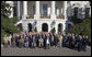President George W. Bush stands for a photograph with veterans of the 57th Bomb Wing from World War II on the South Portico Friday, Oct. 13, 2006. Approximately 10,800 airmen passed through the portals of the 57th Bomb Wing, a command composed of B-25 Mitchell medium bombers, during its time in combat from 1942 to 1945 in North Africa, Sicily, Corsica, and Italy. The B-25 Mitchell’s and their crews were known for their ability to take out bridges, gun positions, and for disrupting enemy troop communications. The 57th was nicknamed, “The Bridge Busters.” The members are in Washington, D.C., for their association's annual reunion Oct. 11-16, 2006. White House photo by Paul Morse
