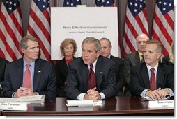 President George W. Bush addresses members of the President’s Management Council, Friday, Oct. 13, 2006, in a meeting at the Eisenhower Executive Office Building in Washington, D.C. Pictured with the President are OMB Director Rob Portman, left, and Labor Deputy Secretary Steven Law. The council met to discuss the President’s Management Agenda accomplishments, which will be summarized in a government-wide report to Federal employees and Congress on the state of the government’s management practices.  White House photo by Eric Draper