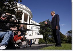 President George W. Bush comments on the passing of a resolution by the United Nations concerning the actions of North Korea before departing the White House on October 14, 2006. White House photo by Paul Morse