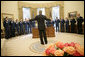 President George W. Bush gestures as he speaks to the U.S. Air Force Thunderbirds during their visit to the Oval Office, Friday, Sept. 13, 2006. The Thunderbirds are scheduled to perform a fly over for the opening of the Air Force Memorial in Arlington, Va., Saturday, Oct. 14, 2006. White House photo by Eric Draper