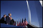 President George W. Bush observes the Air Force Thunderbirds performing at the dedication of the United States Air Force Memorial in Arlington, Virginia on October 14, 2006. White House photo by Paul Morse