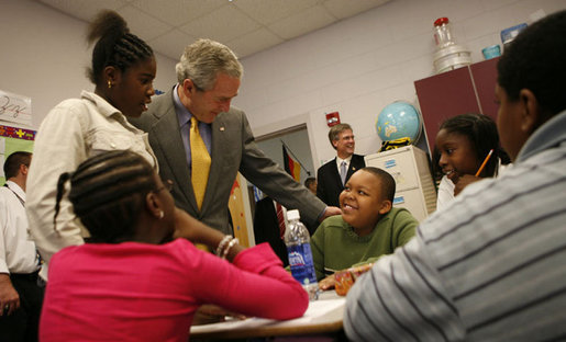 President George W. Bush spends time with students at the Waldo C. Falkener Elementary School Wednesday, Oct. 18, 2006, in Greensboro, N.C. The President visited with third- and fifth-graders before delivering his remarks on the No Child Left Behind Act. White House photo by Paul Morse