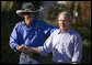 President George W. Bush enjoys a moment with NASCAR racing champion Richard Petty during a visit Wednesday, Oct. 18, 2006, to the Victory Junction Gang Camp, Inc., in Randleman, N.C. The center was founded by Petty's son, Kyle, and Kyle's wife, Pattie, in memory of their son, Adam, a fourth-generation NASCAR driver killed during practice in 2000. White House photo by Paul Morse